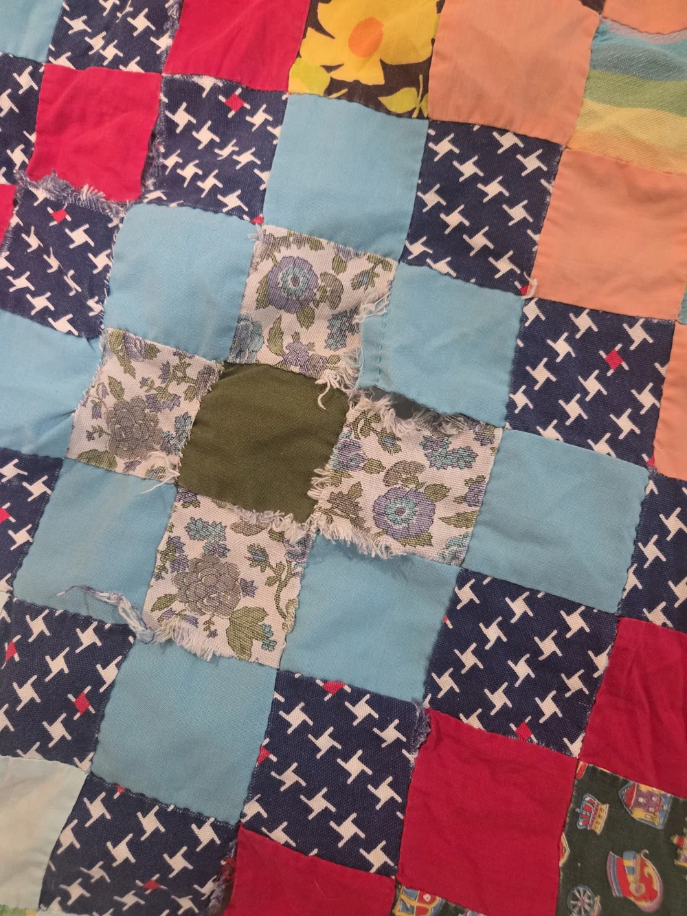 handmade patchwork quilt features a vibrant 